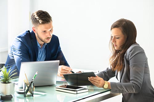 Two Businesspeople Using Digital Tablet